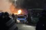 Полицейска кола запалена по време на сблъсъци с протестиращи в центъра на Алмати
