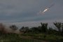 Украински военнослужещи изстрелват ракета по руските войски близо до фронтовия град Бахмут в петък.